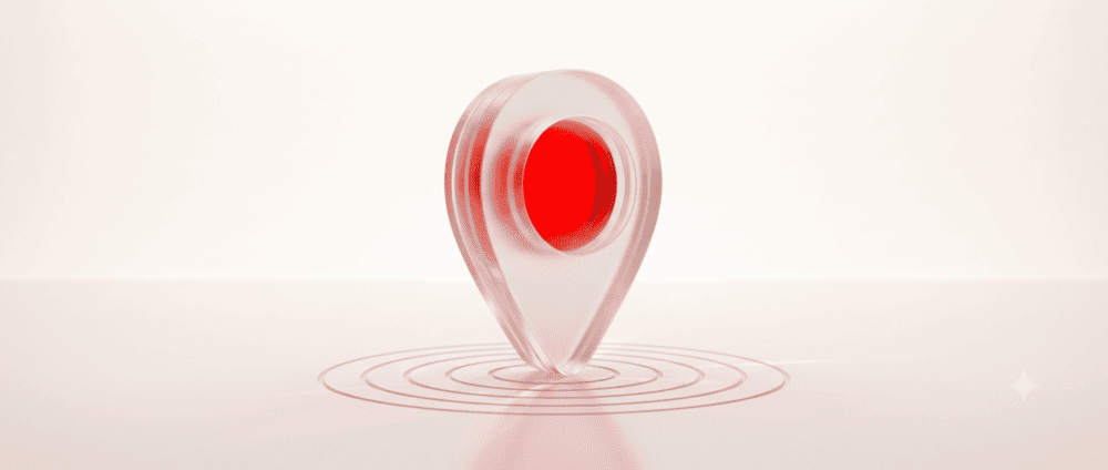 Frosted glass map pin with red core over etched rings