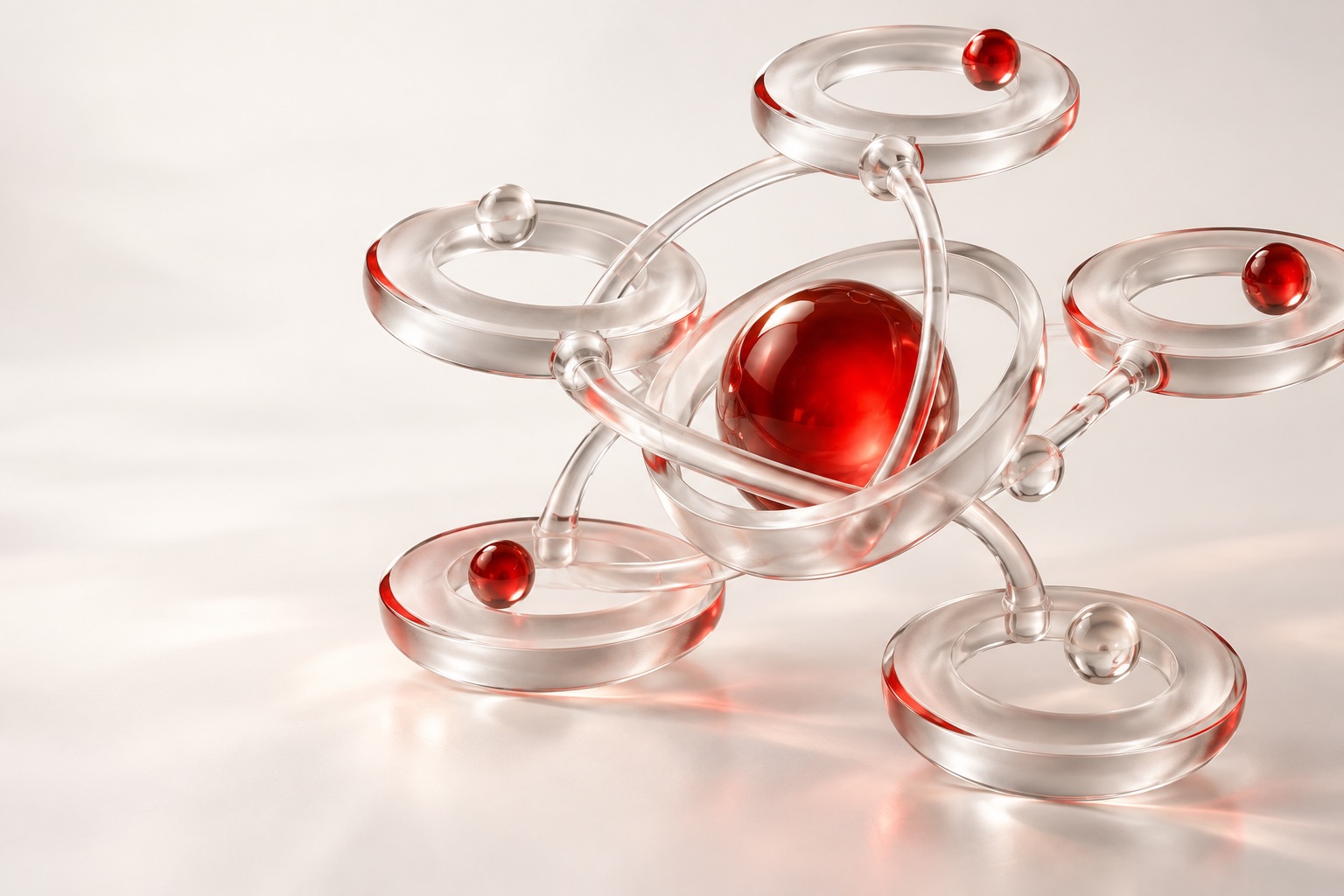 Connected clear-glass orbits surrounding a red sphere.